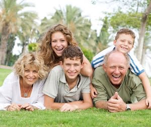 family on grass. how life insurance works in your estate plan